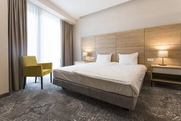 Фото номера Стандартные апартаменты Отель Polanka Conference Center г. Кросно 2